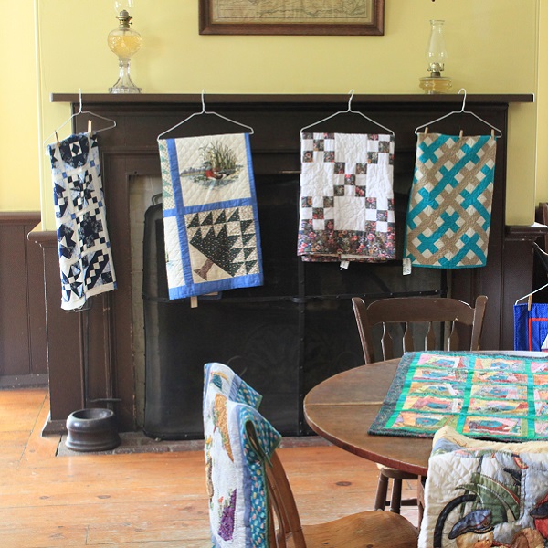Quilts on display during Harvest Festival at Black Creek