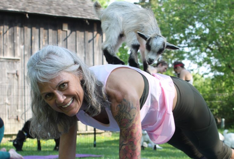 woman at Black Creek Pioneer Village goat yoga class