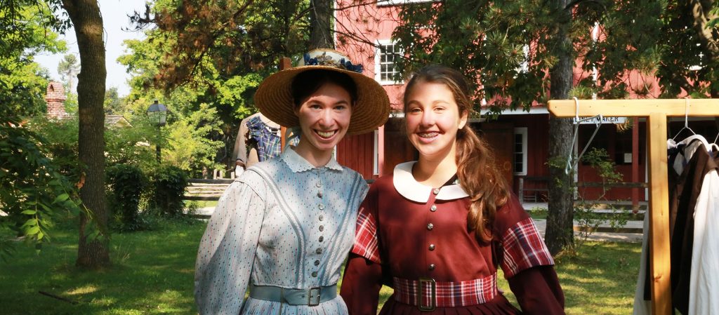 young girl and history actor in period costume