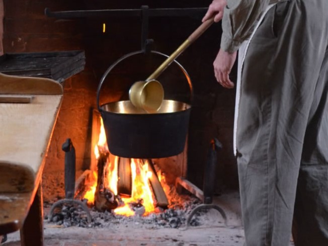 Cider being heated over an open flame