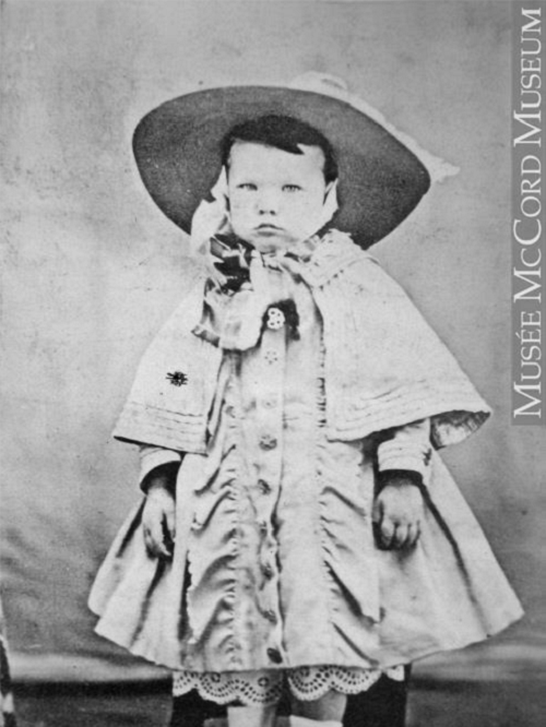 photograph of toddler in Victorian clothing