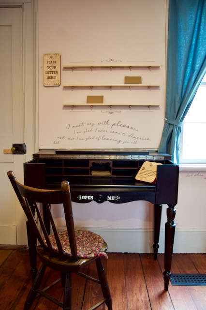 writing desk in parlour of Flynn House activity at The Village at Black Creek