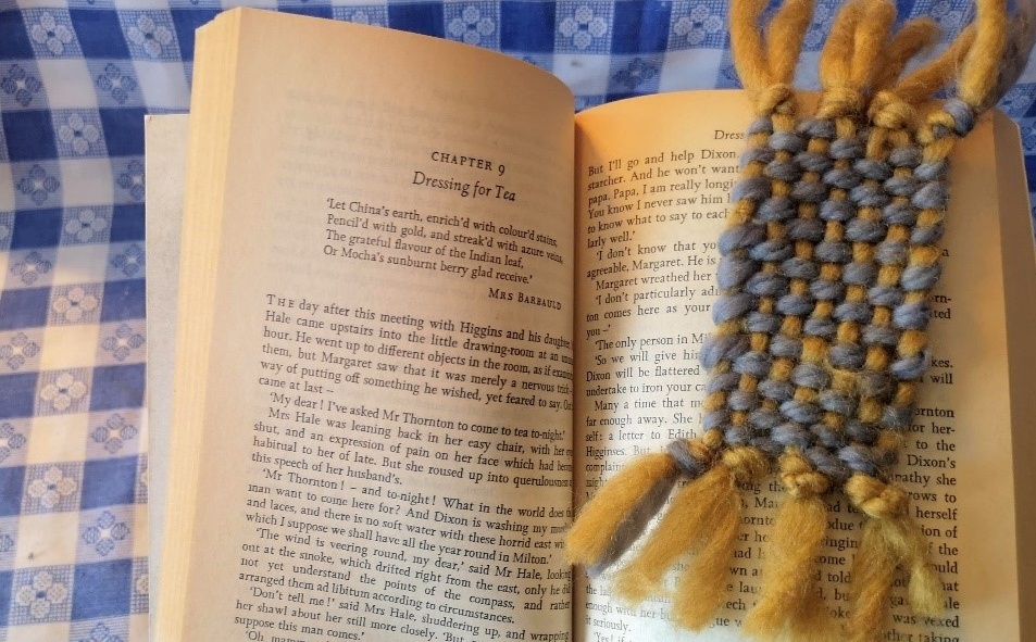 crafter marks page with woven bookmark