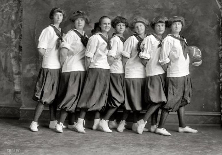 girls basketball team wearing uniform of bloomers and middys