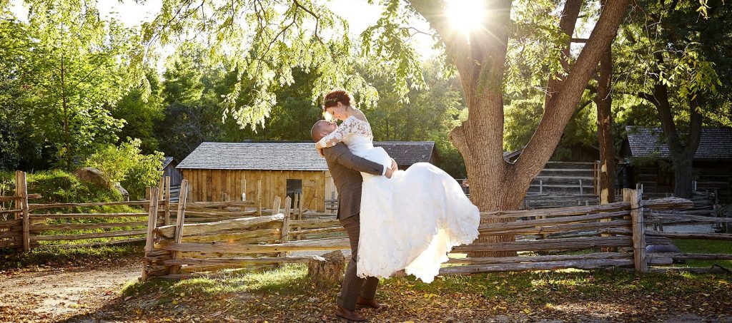 young couple poses for wedding photograph at Black Creek Pioneer Village