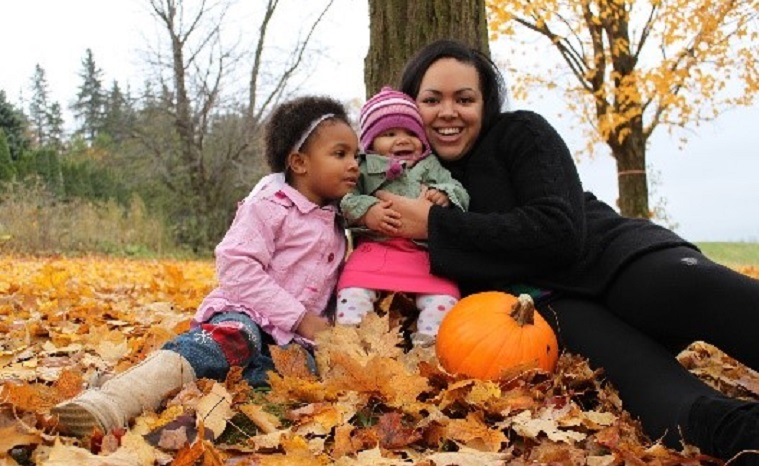 young family enjoys a self-guided weekend tour of Black Creek Village in the fall