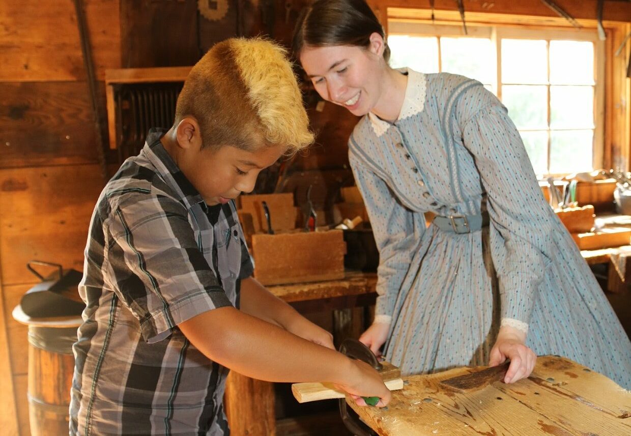 student learns traditional woodworking technique at Black Creek Village