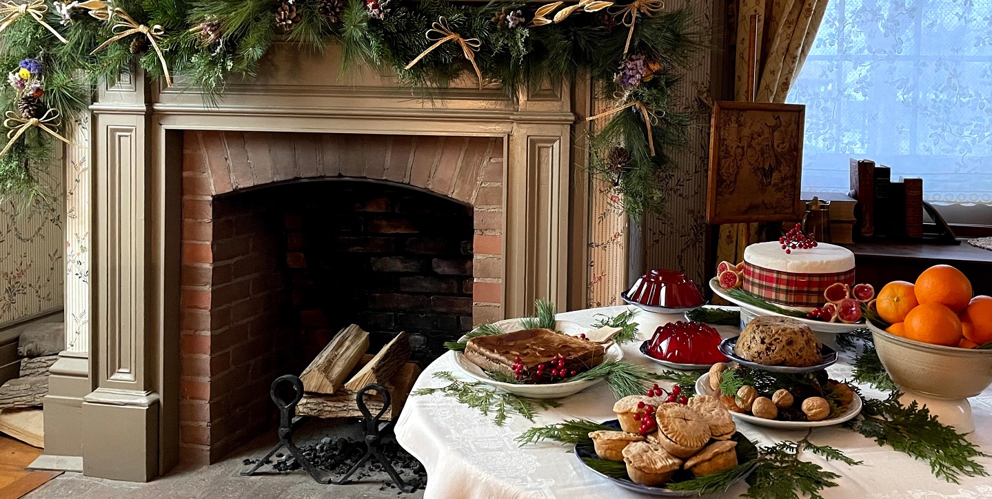 a table spread with traditional Victorian Christmas delicacies
