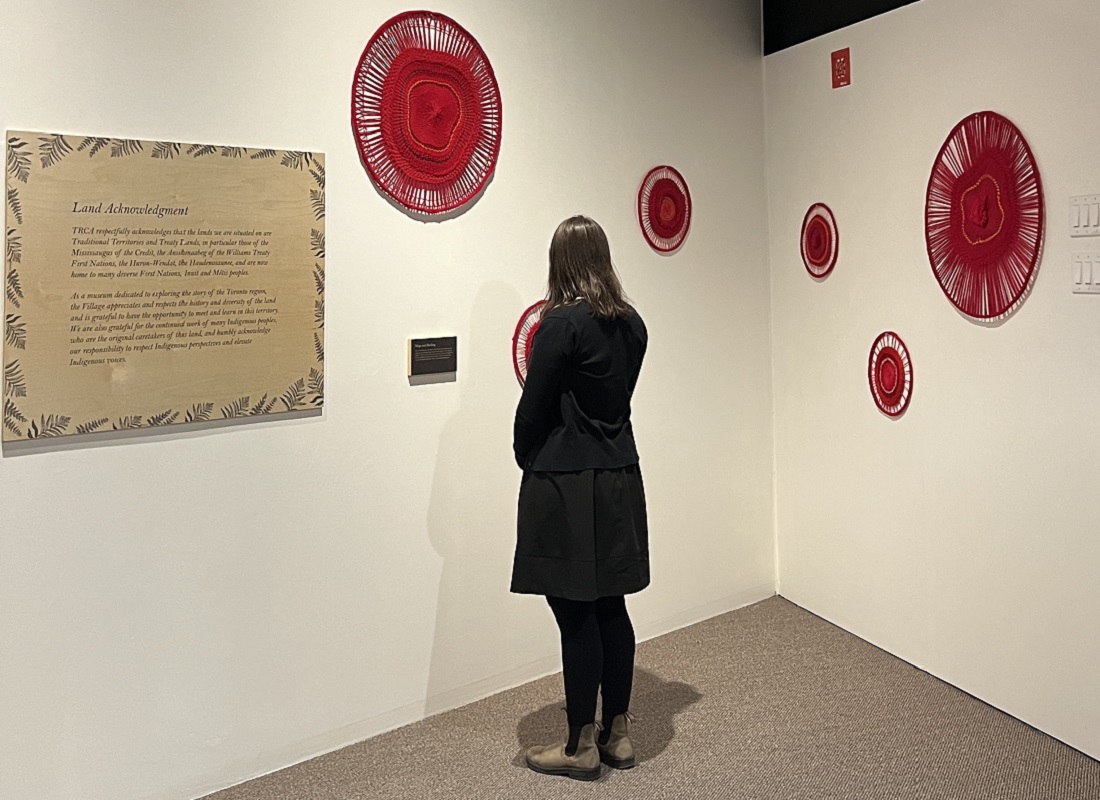 a visitor to The Village at Black Creek explores the permanent exhibition of work by Metis artist Tracey-Mae Chambers at the McNair Gallery