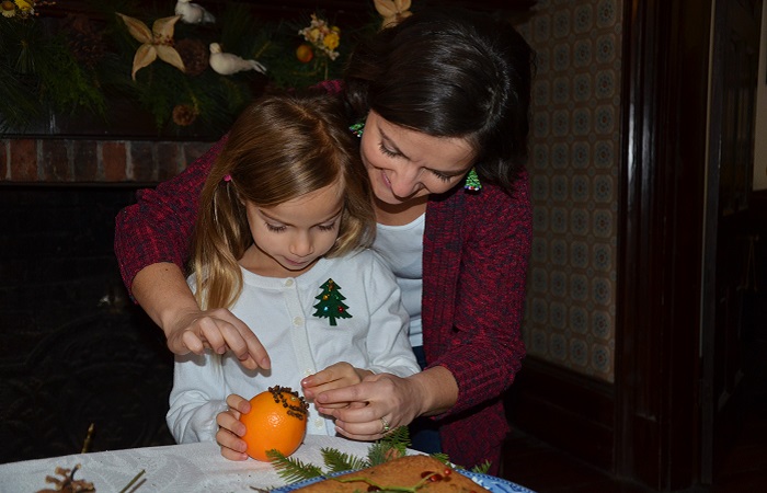 mother and daughter create holiday crafts during Santa at the Village event at Black Creek Pioneer Village