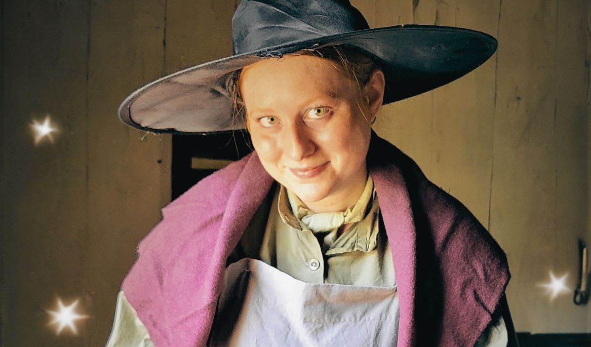 history actor in witches hat welcomes youngsters to the Wizard Academy at Black Creek Pioneer Village