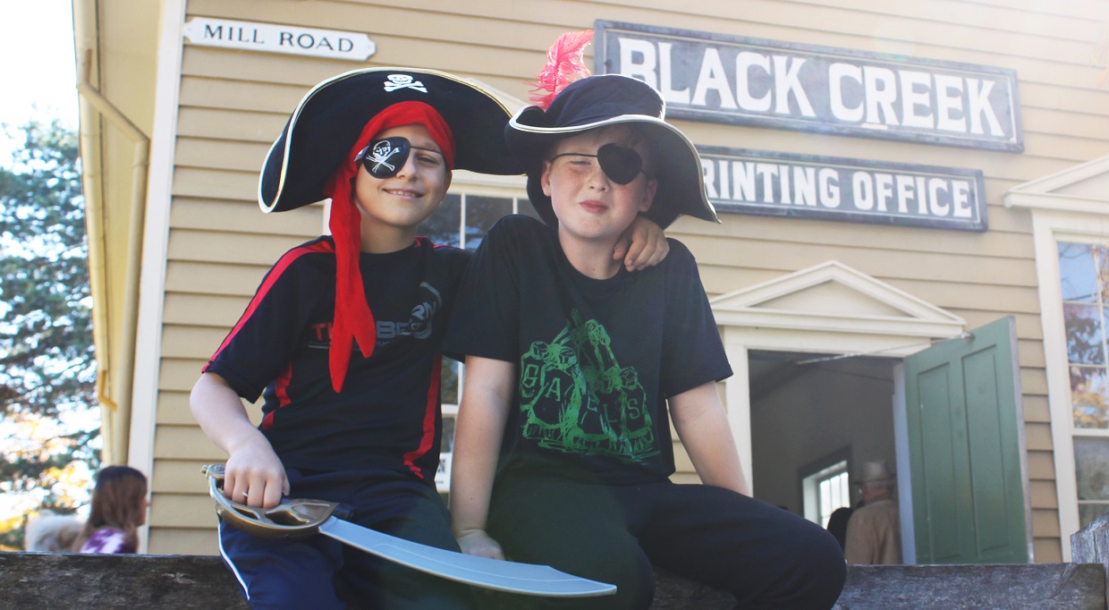 students in costume enjoy Halloween at Black Creek Pioneer Village