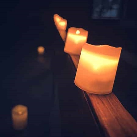 candles on a railing