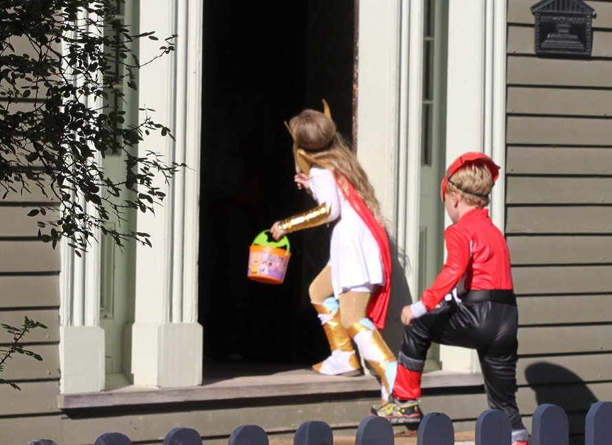 youngsters in Halloween costumes enjoy trick or treating at the Village at Black Creek