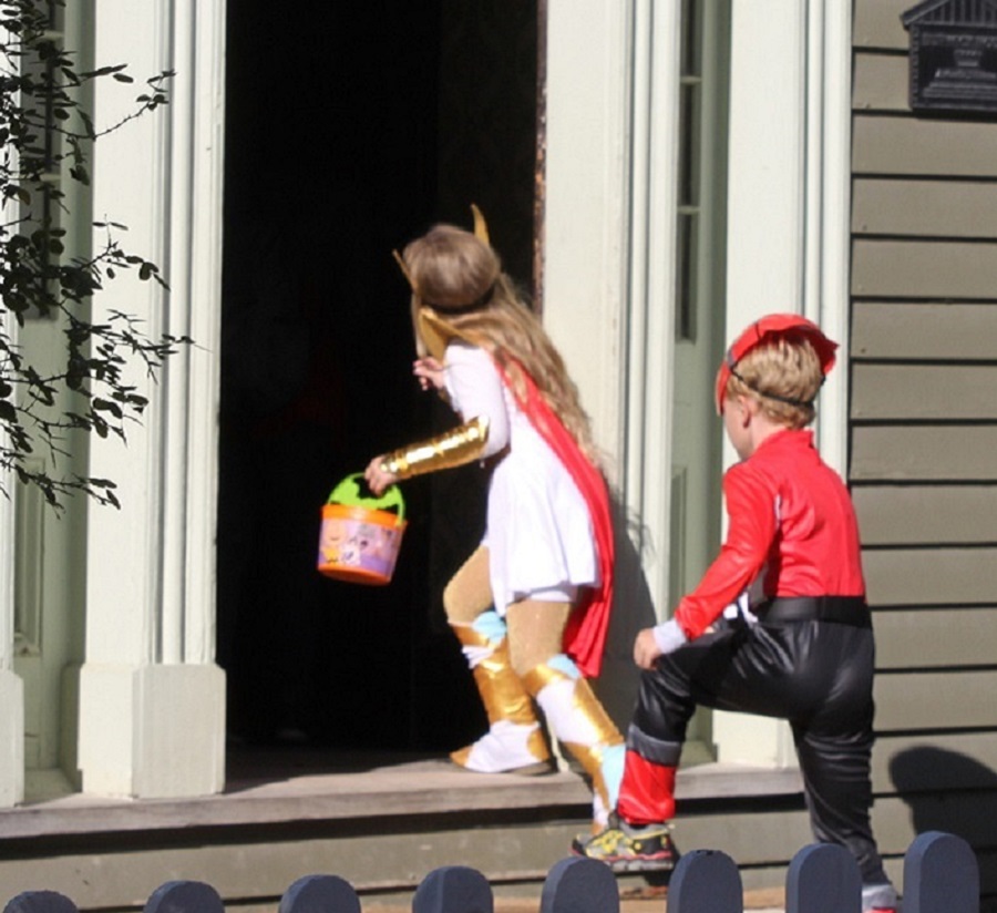 youngsters in Halloween costumes enjoy trick or treating at the Village at Black Creek