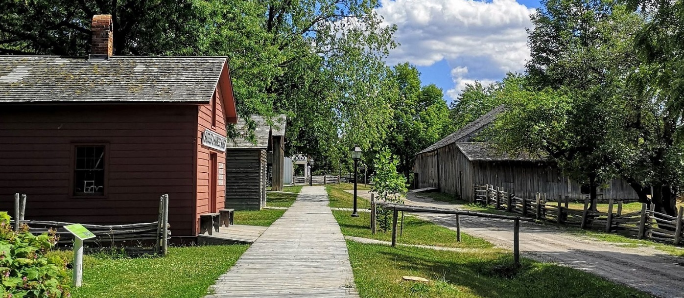 heritage buildings line a street at the Village at Black Creek