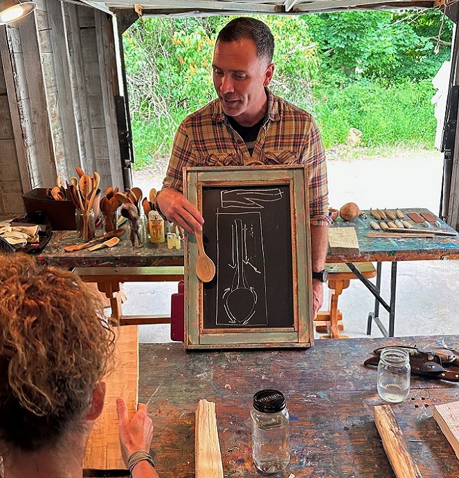 an Indigenous artist delivers a presentation to visitors during the Village at Black Creek First Saturdays series