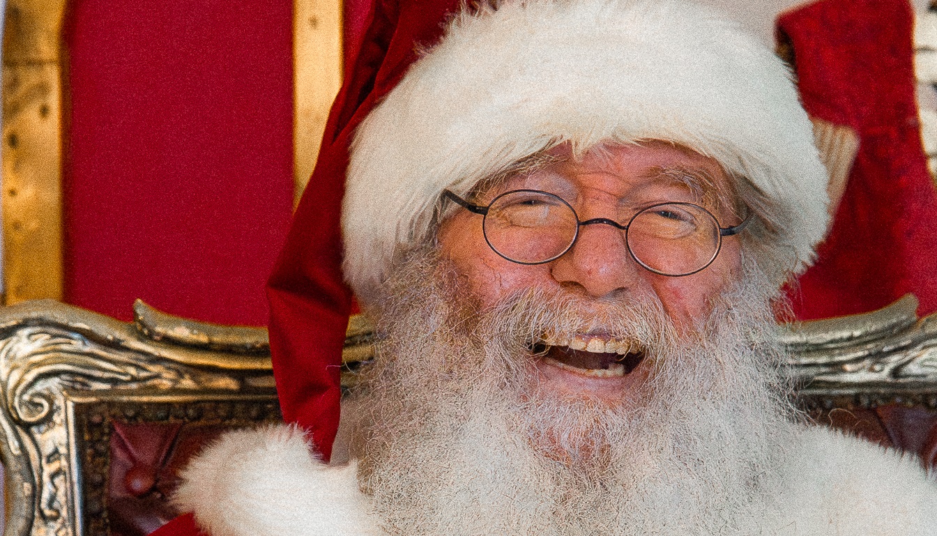 Santa Claus welcomes visitors to his workshop at The Village at Black Creek