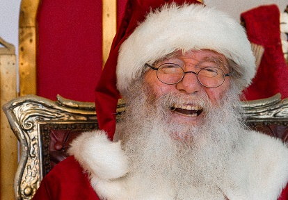 Santa Claus welcomes visitors to his workshop at The Village at Black Creek