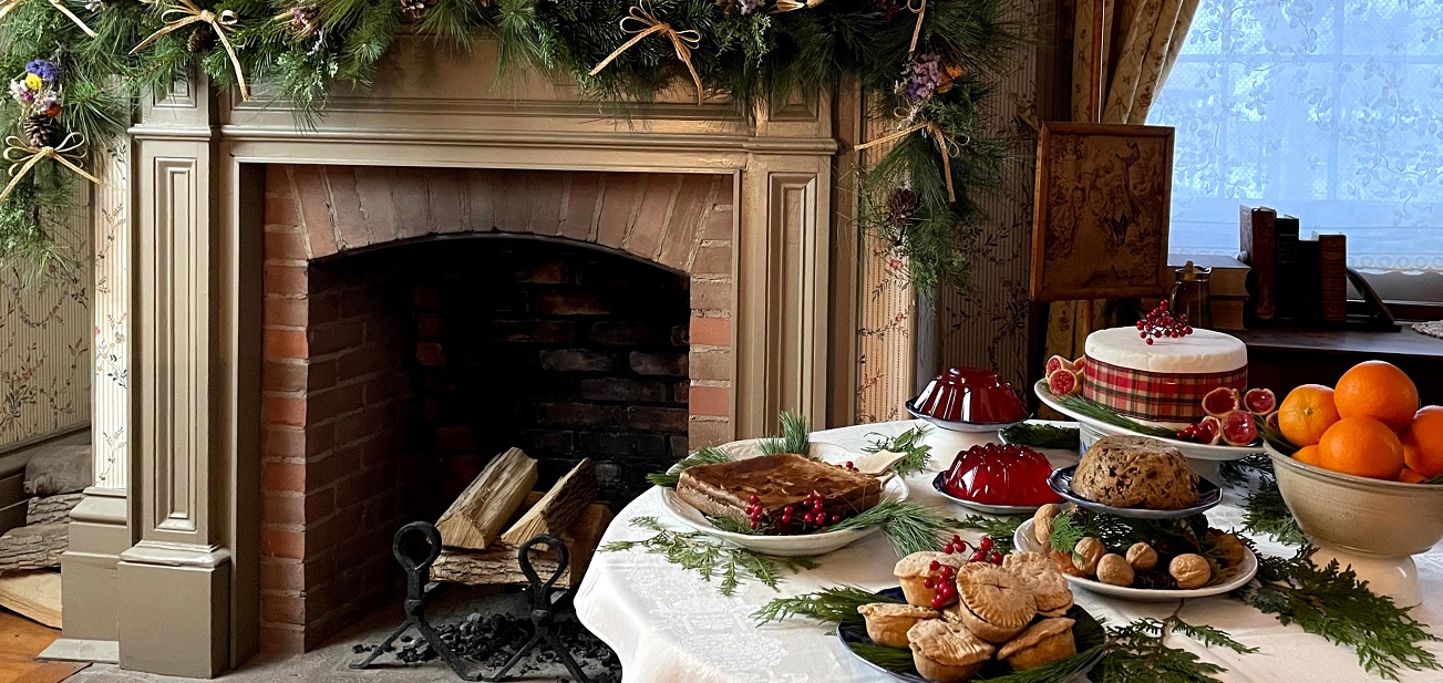 a table laden with traditional Victorian holiday season treats at The Village at Black Creek