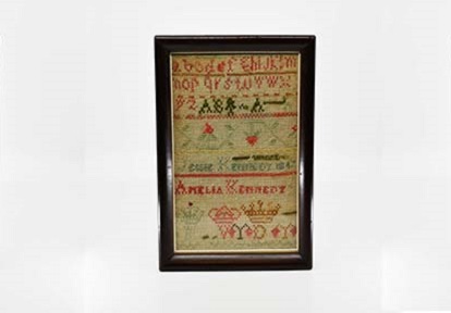 a hand-stitched sampler