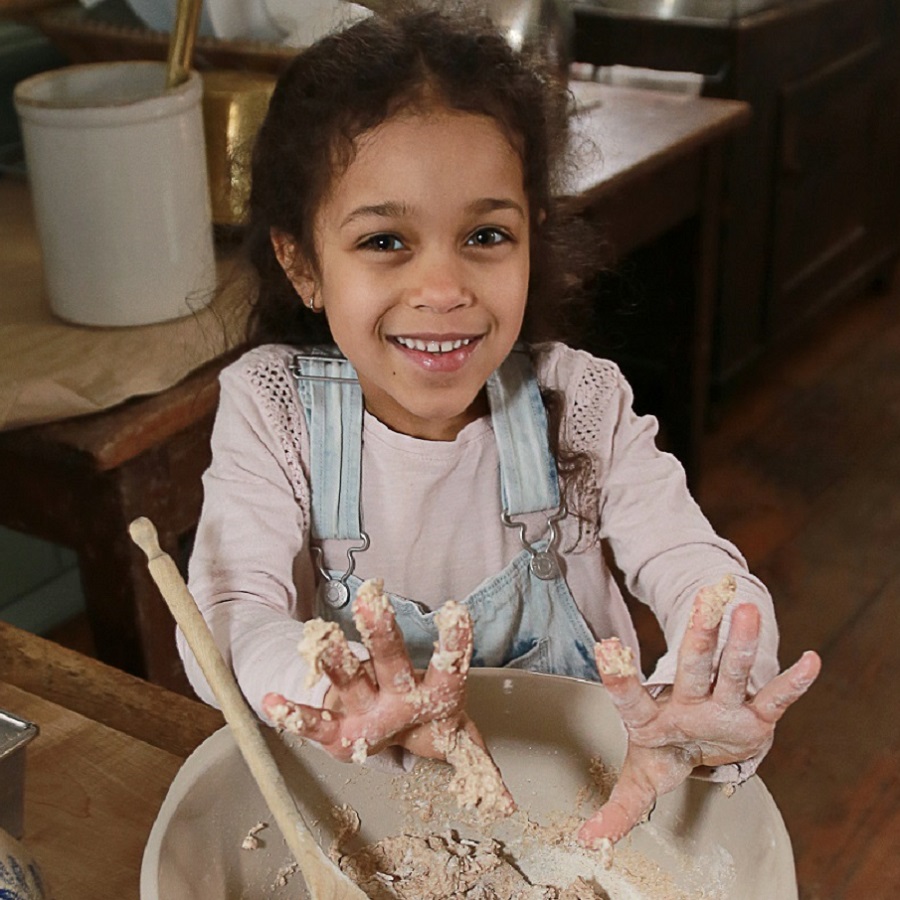 Summer Camp & Teen Experiences at The Village 2 a camper learns to bake the 19th century way at a Village of Black Creek summer camp