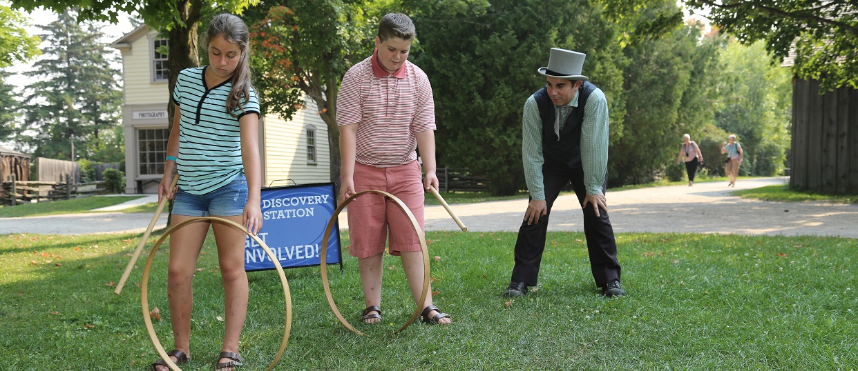 costumed educator takes teen summer campers behind the scenes at The Village at Black Creek