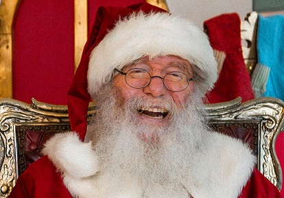 Santa Claus welcomes visitors to his workshop at The Village at Black Creek