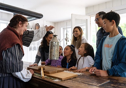 teachers and students visit the tinsmith shop at The Village at Black Creek