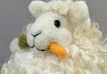 a needle felted sheep figure