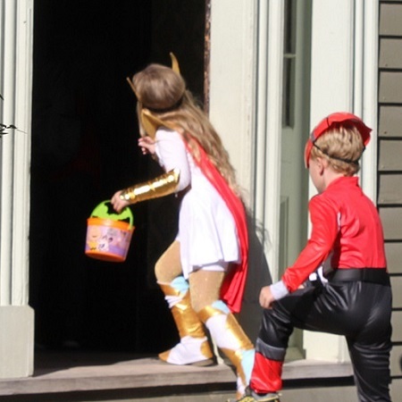 What's On At The Village 23 children trick or treat at a heritage building during the Halloween event at The Village at Black Creek