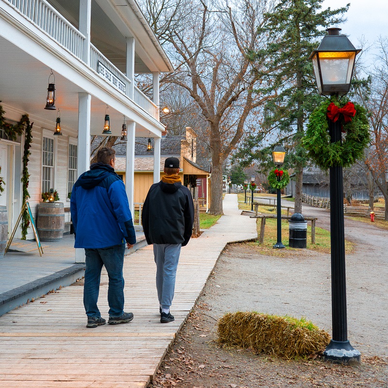 Teachers, Schools & Groups 11 a student and teacher explore the Village at Black Creek during the holiday season