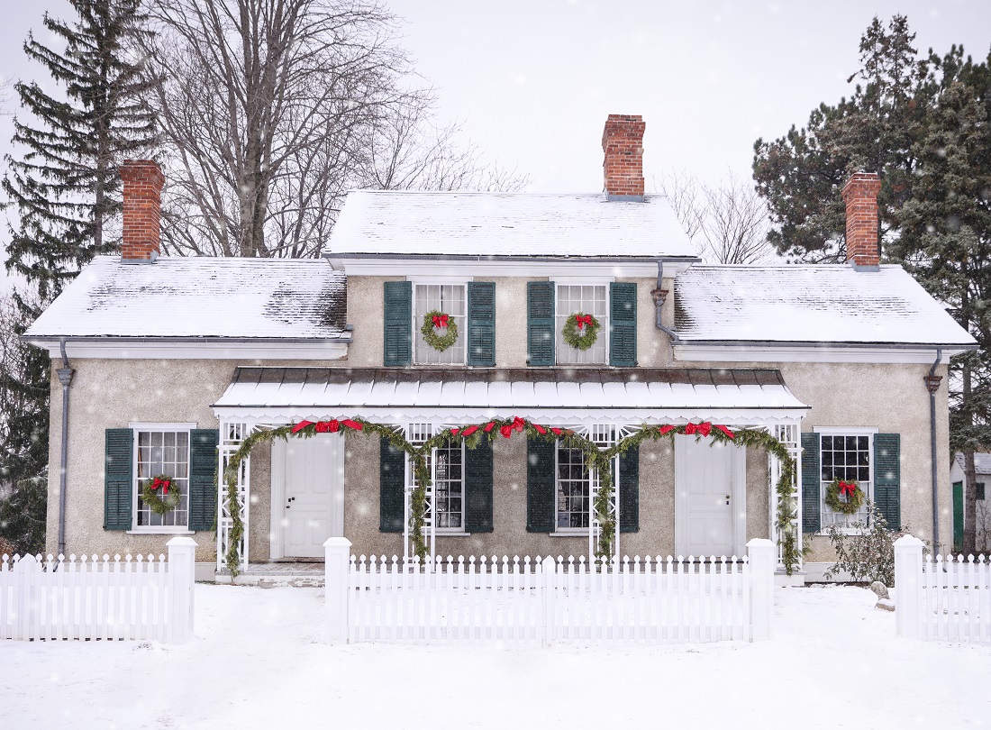 Holidays at The Village 20 a heritage house at The Village at Black Creek is adorned with festive holiday decorations on a snowy day in December