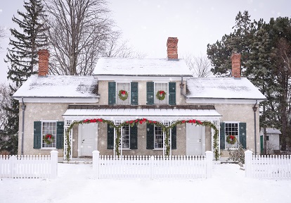 Holidays at The Village 7 a heritage house at The Village at Black Creek is adorned with festive holiday decorations on a snowy day in December