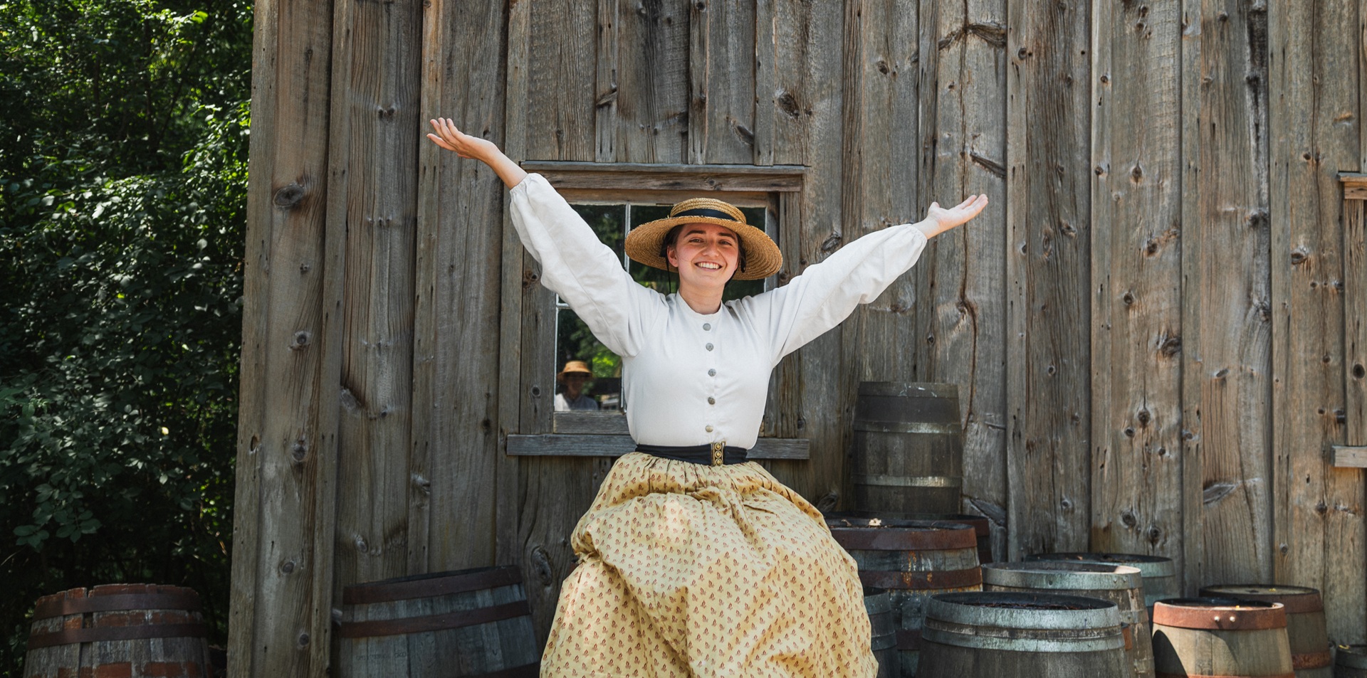 a costumed historian at The Village at Black Creek