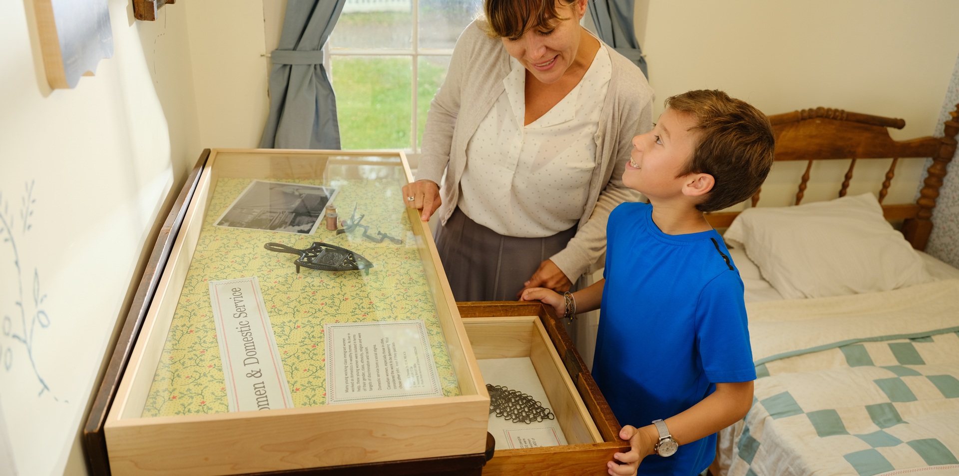 visitors looking at the displays in the room at The Village at Black Creek
