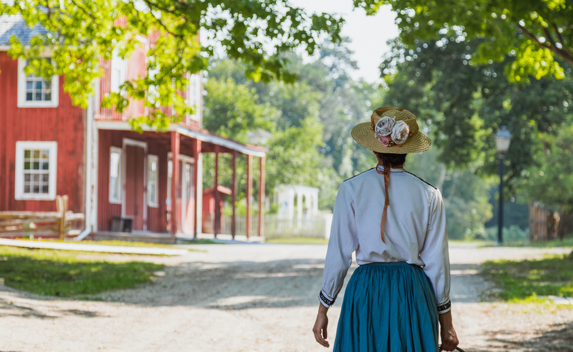 a costumed historian at The Village at Black Creek