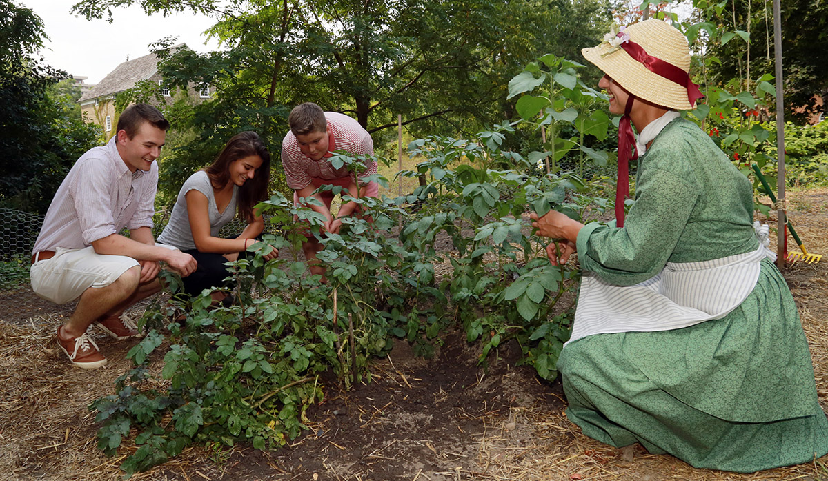 High school group learns about gardening on a field trip to the Village at Black Creek