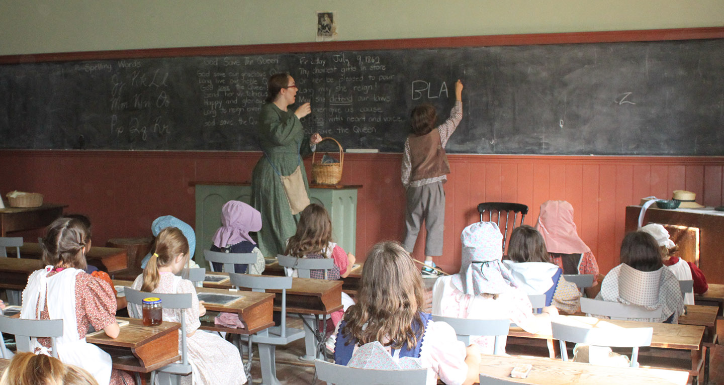 students take part in a re-creation of a pioneer school day