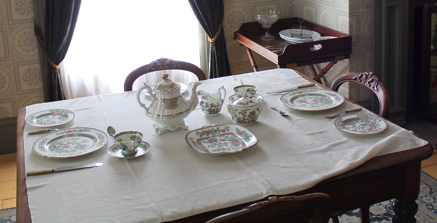 table set with fine china at Black Creek Pioneer Village Doctors House