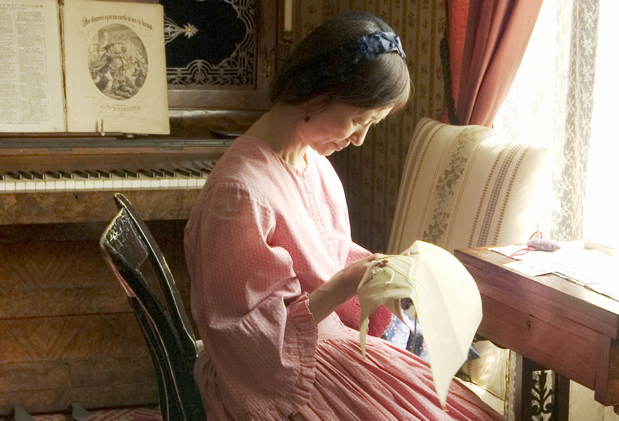 a seamstress at work sewing clothes