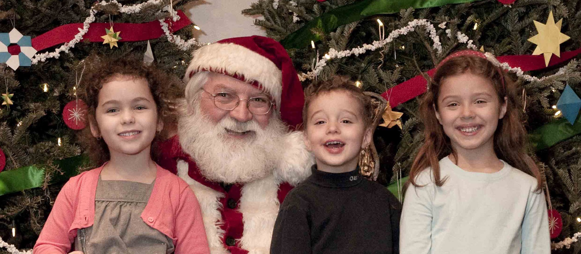 Santa Claus with youngsters at Black Creek Pioneer Village Christmas event